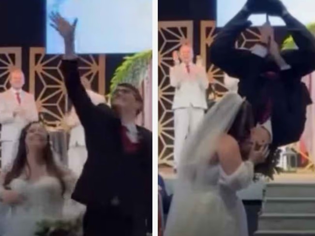 വധുവിന് ‘സ്പൈഡർമാർ കിസ്’ നൽകുന്ന വരൻ അതും  തല കീഴായി തൂങ്ങിക്കിടന്ന് : വീഡിയോ വൈറൽ