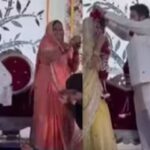 വധുവിന് മാല ചാർത്തുന്ന ചടങ്ങിനിടെ സ്പാർക്കിൾ ഗൺ പൊട്ടിച്ച്  വരന്റെ അമ്മൂമ്മ; ജീവനുംകൊണ്ടോടി അതിഥികൾ